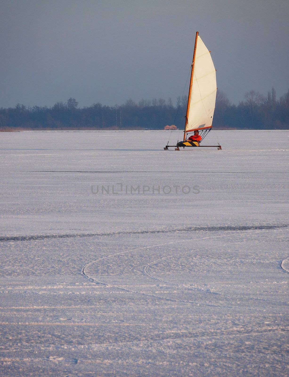 Sailing on a frozen lake in the Netherlands