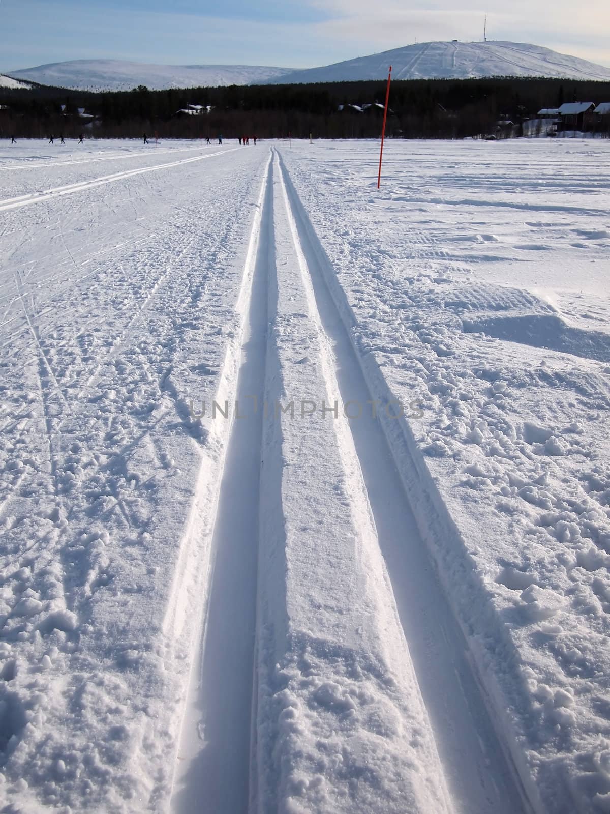 Cross-country tracks on a frozen lake in Lapland.
