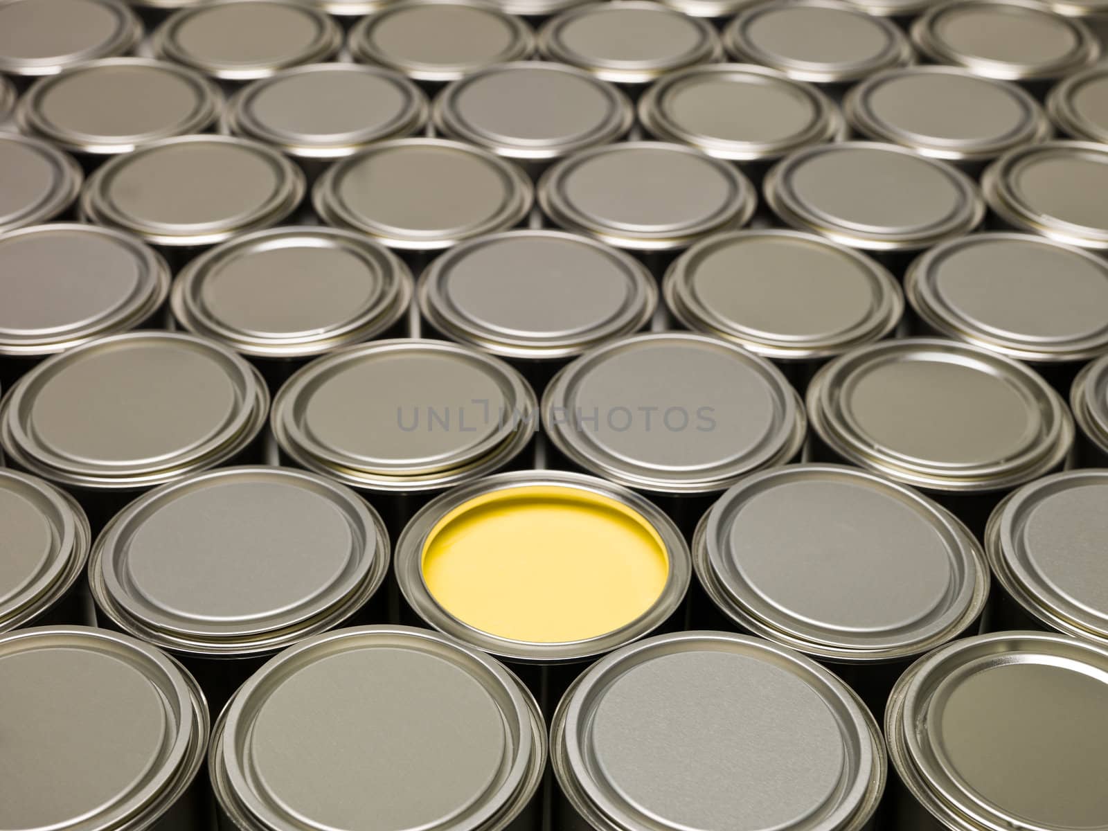 Full Frame of Paint Cans, one filled with Yellow paint