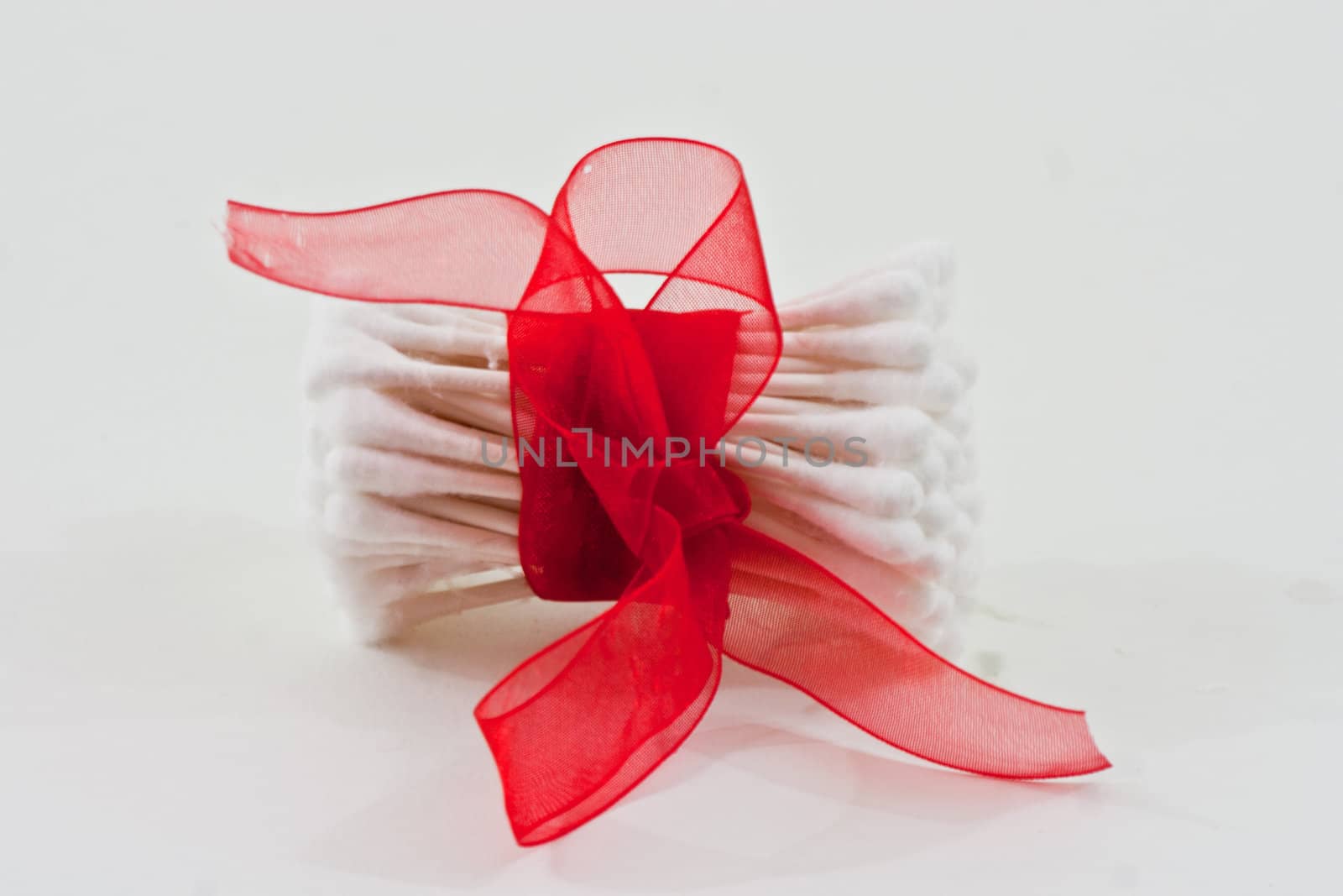 The top of cotton swabs with red bow