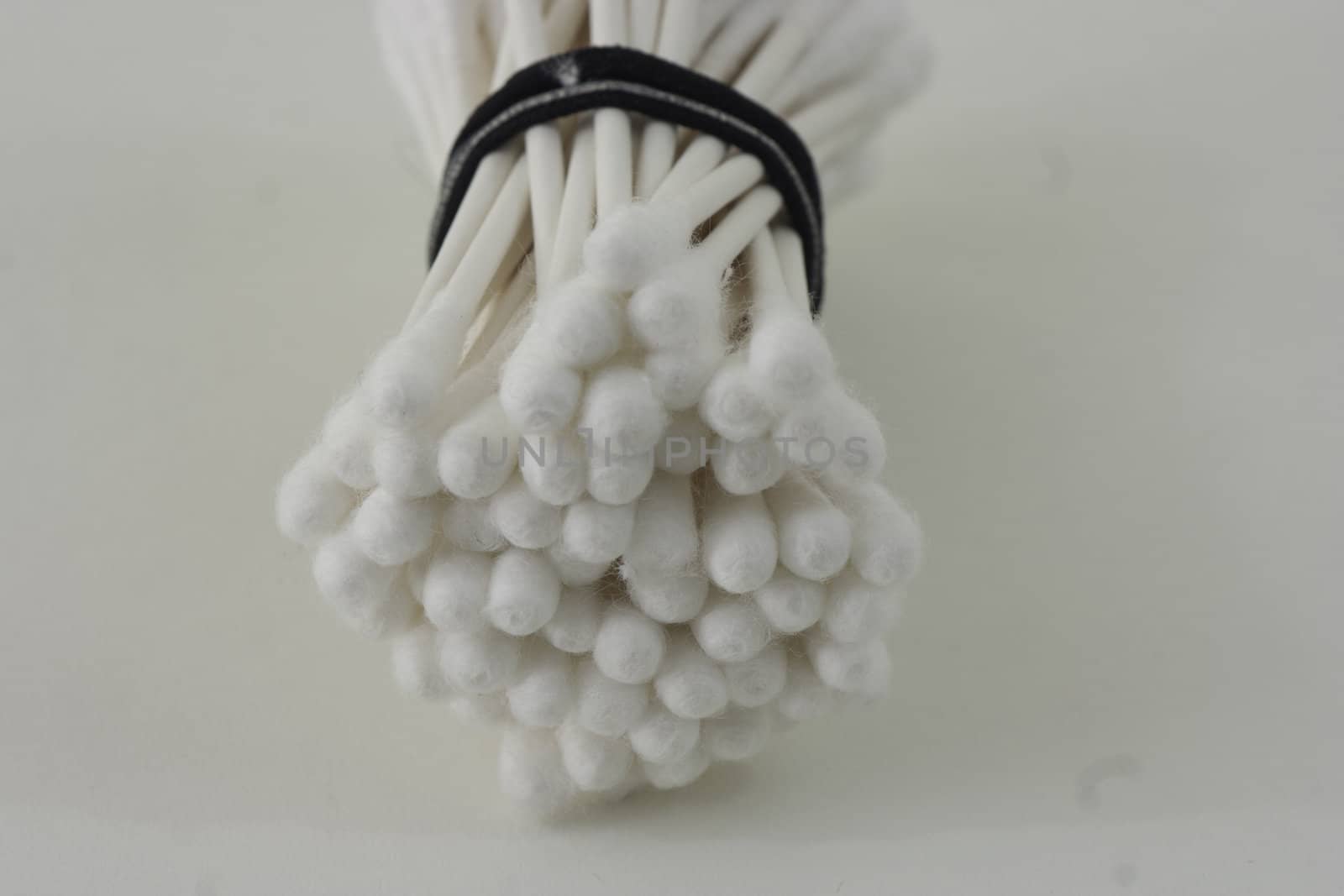 A bundle of cotton swabs on white background.