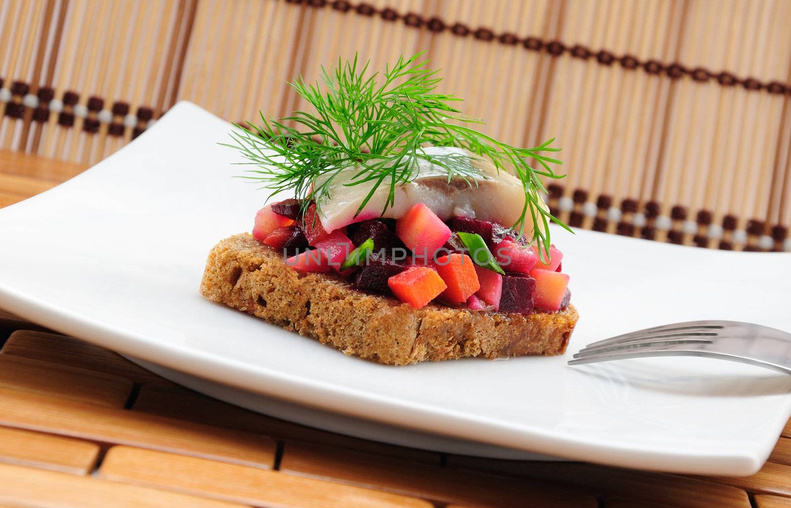 Sandwiches with rye bread, herring and vegetables