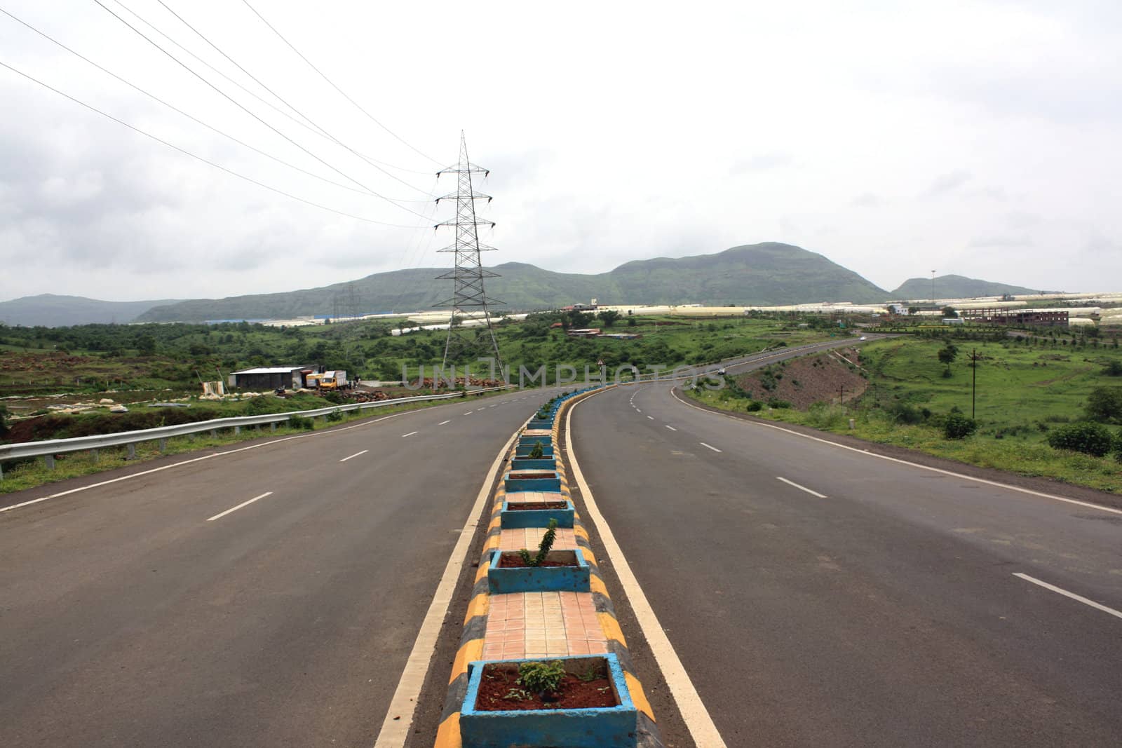 A long stretch of an empty highway in India.