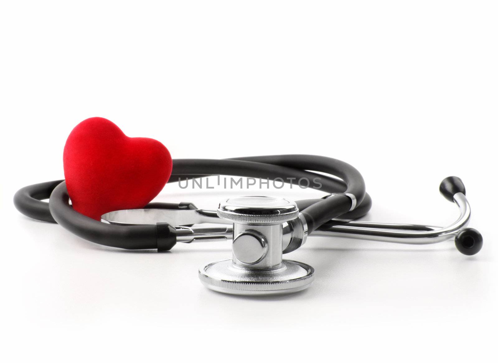 Stethoscope with heart on white by Sandralise