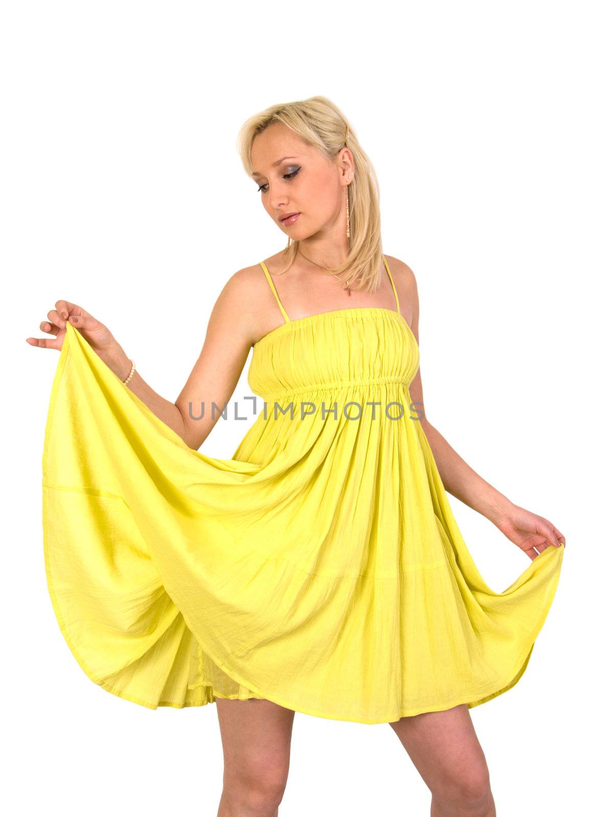 The girl in a yellow summer dress it is isolated on a white background.