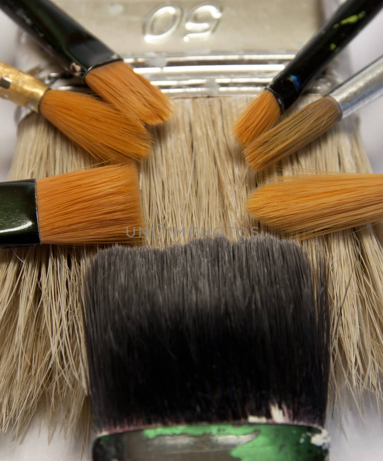 close up of different paintbrushes sizes, colors