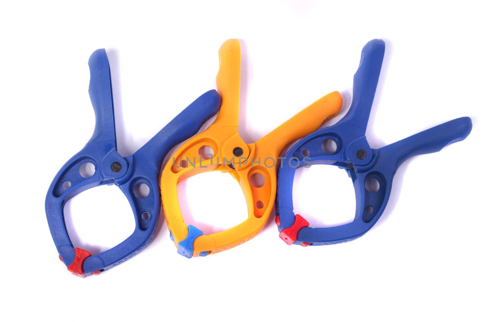 Close up view of some clamps isolated on a white background.