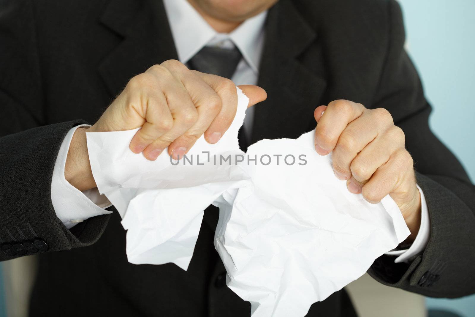 Businessman violently tormented the paper in his hands