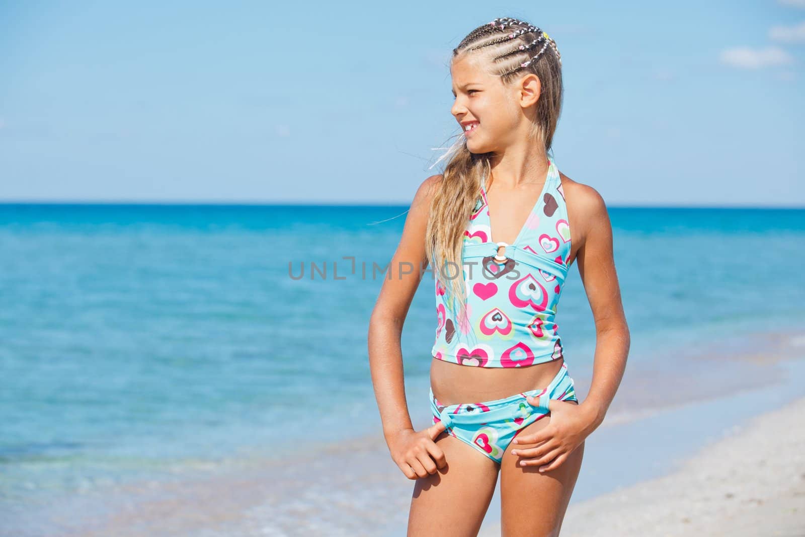 happy beautiful girl looking at the sea