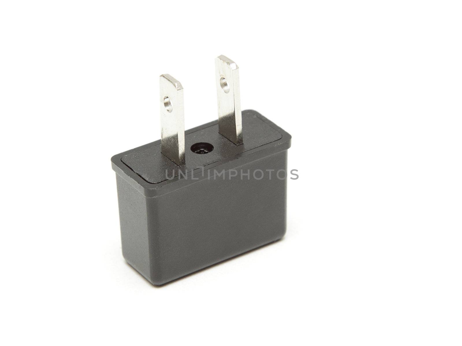 Power plug adapter isolated on white by pulen