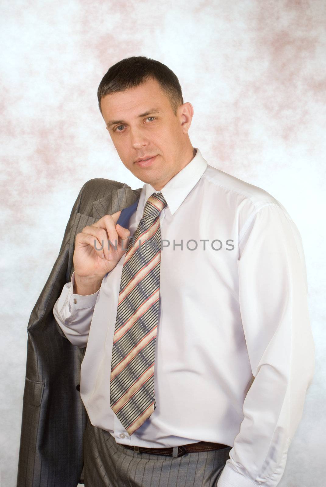 Portrait of the  businessman on an abstract background