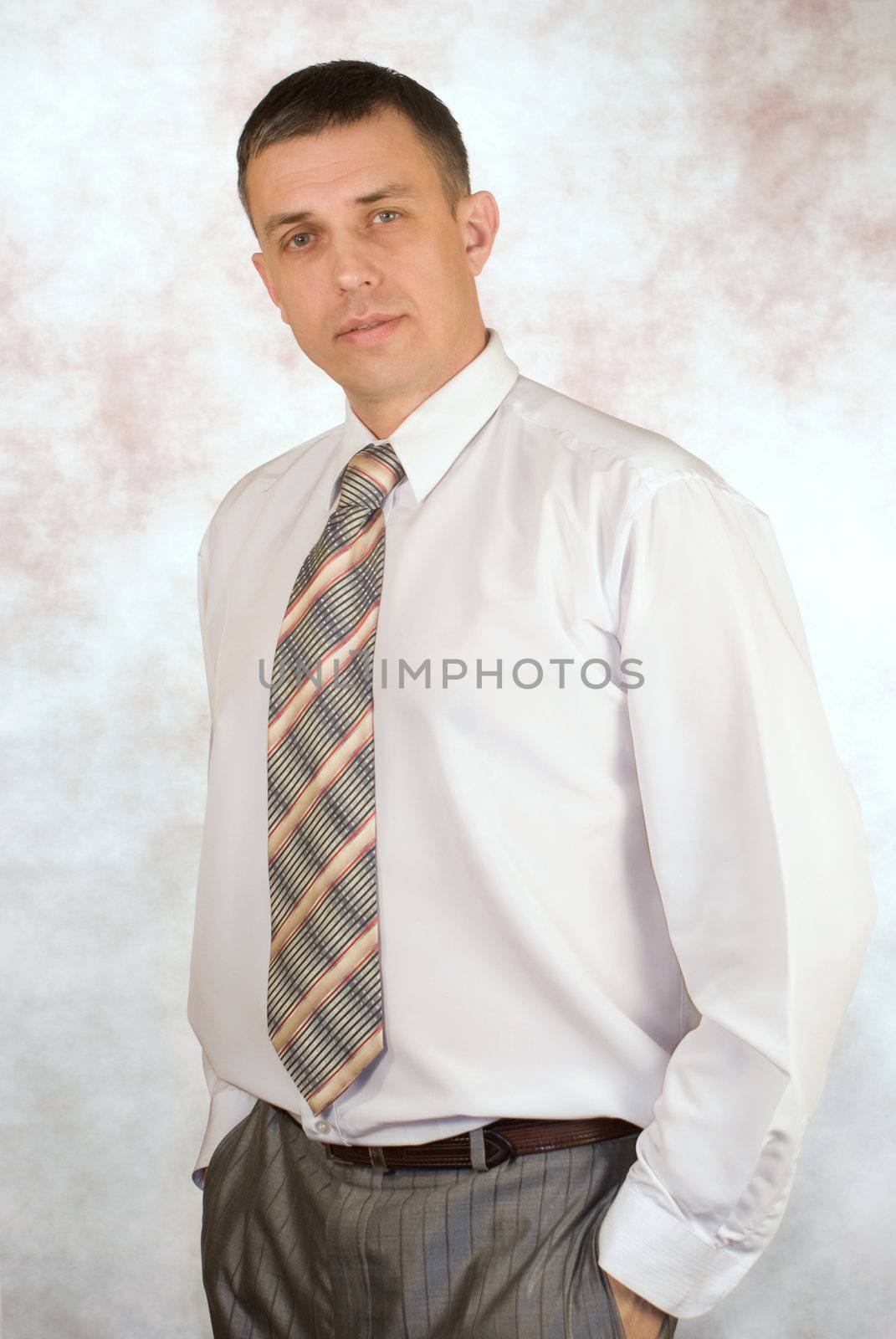 Portrait of the  businessman on an abstract background