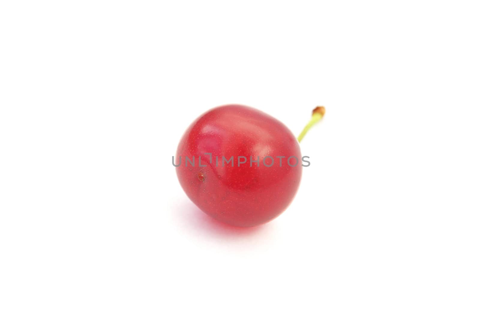 Closeup photo of red ripe cherry isolated on white background