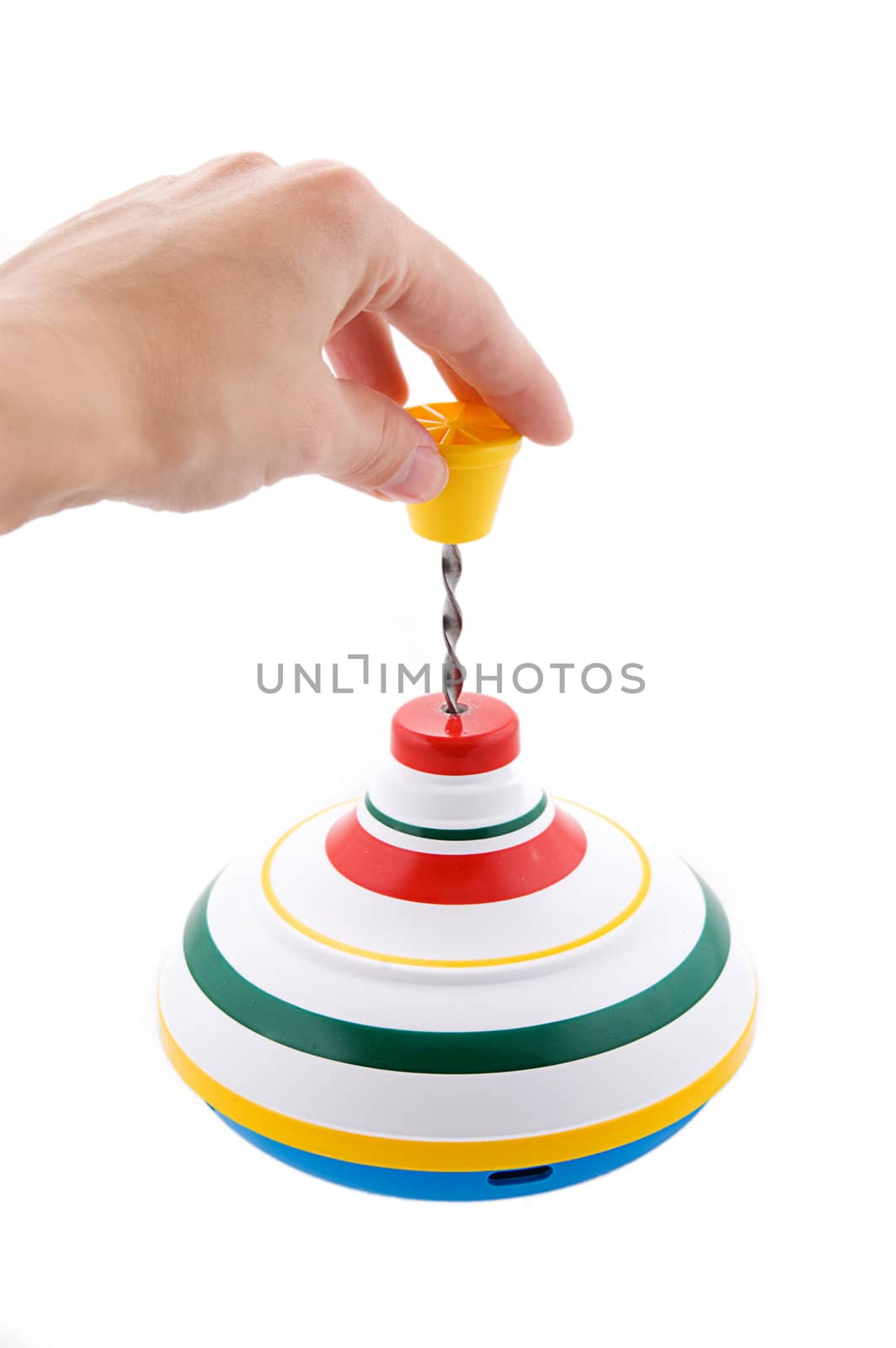 Hand playing whirligig isolated on white