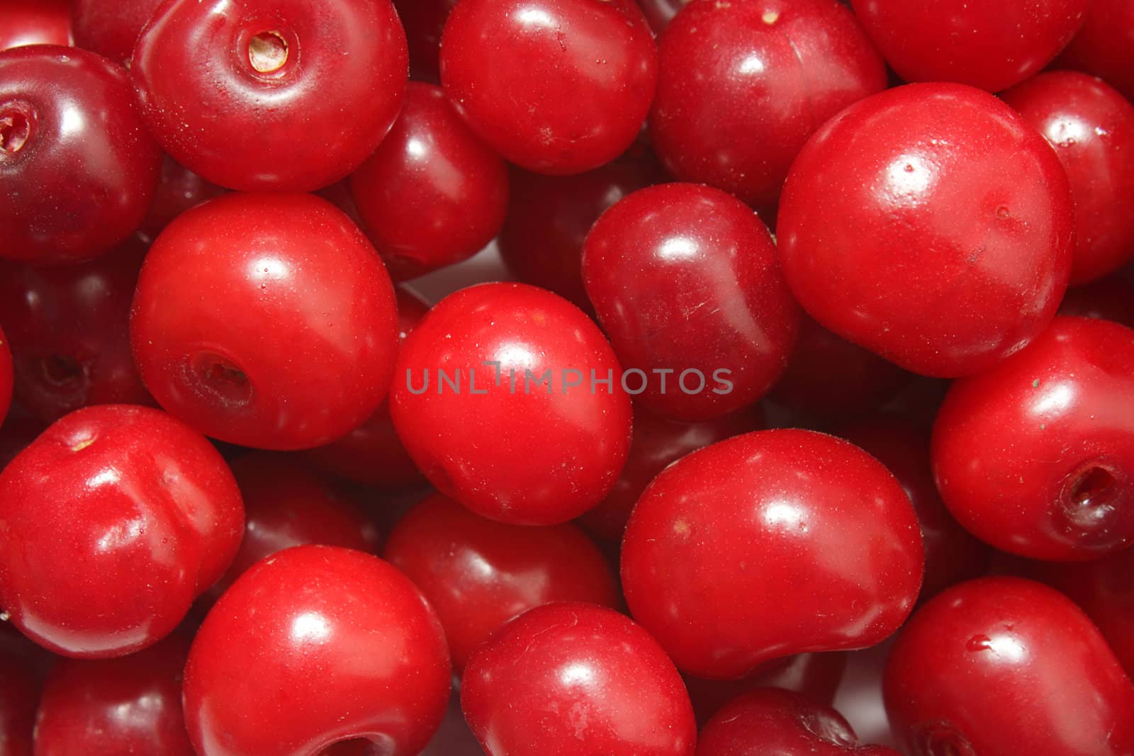 Ripe red cherries background by pulen
