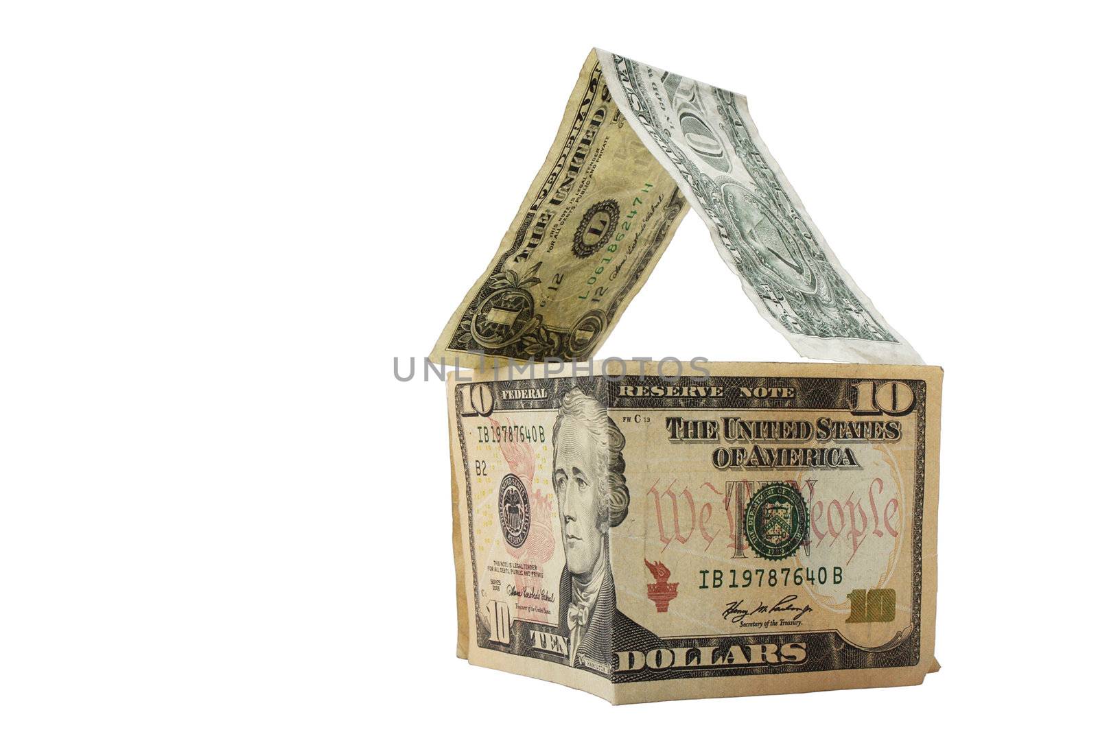 Dollars forming a house on white background by pulen