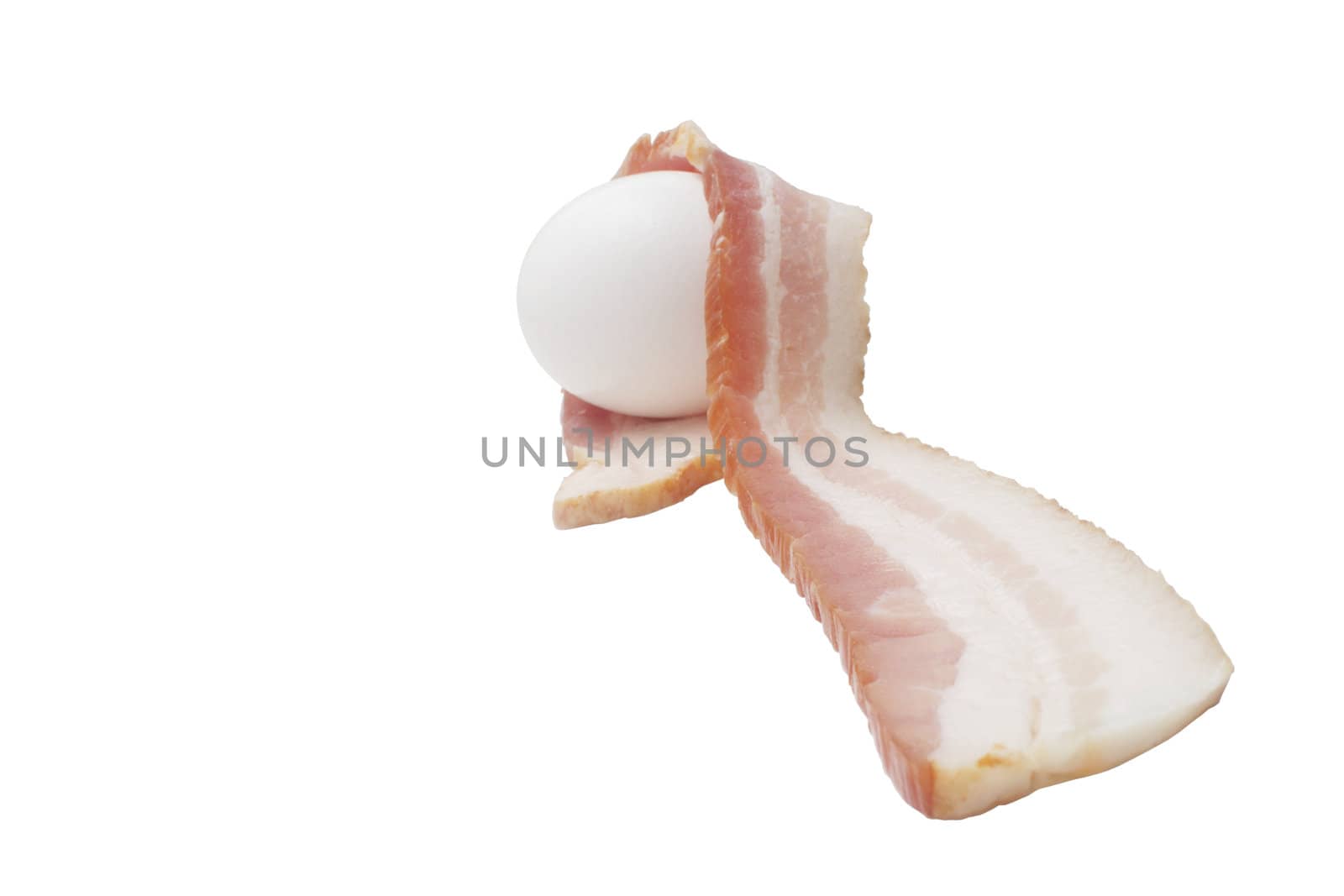 Raw egg and a slice of smoked bacon isolated on white background