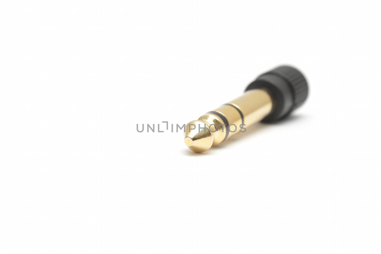 Golden headphone plug adapter isolated on white background