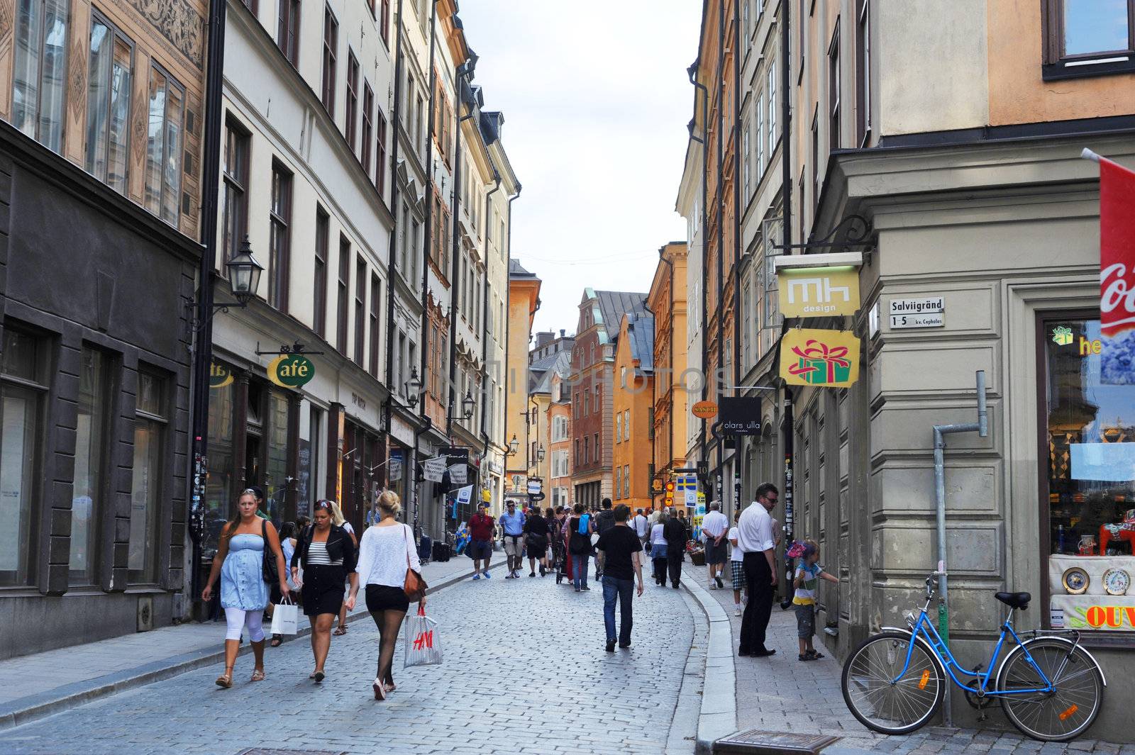 Central street of Gamla Stan with many tourists. Sweden
