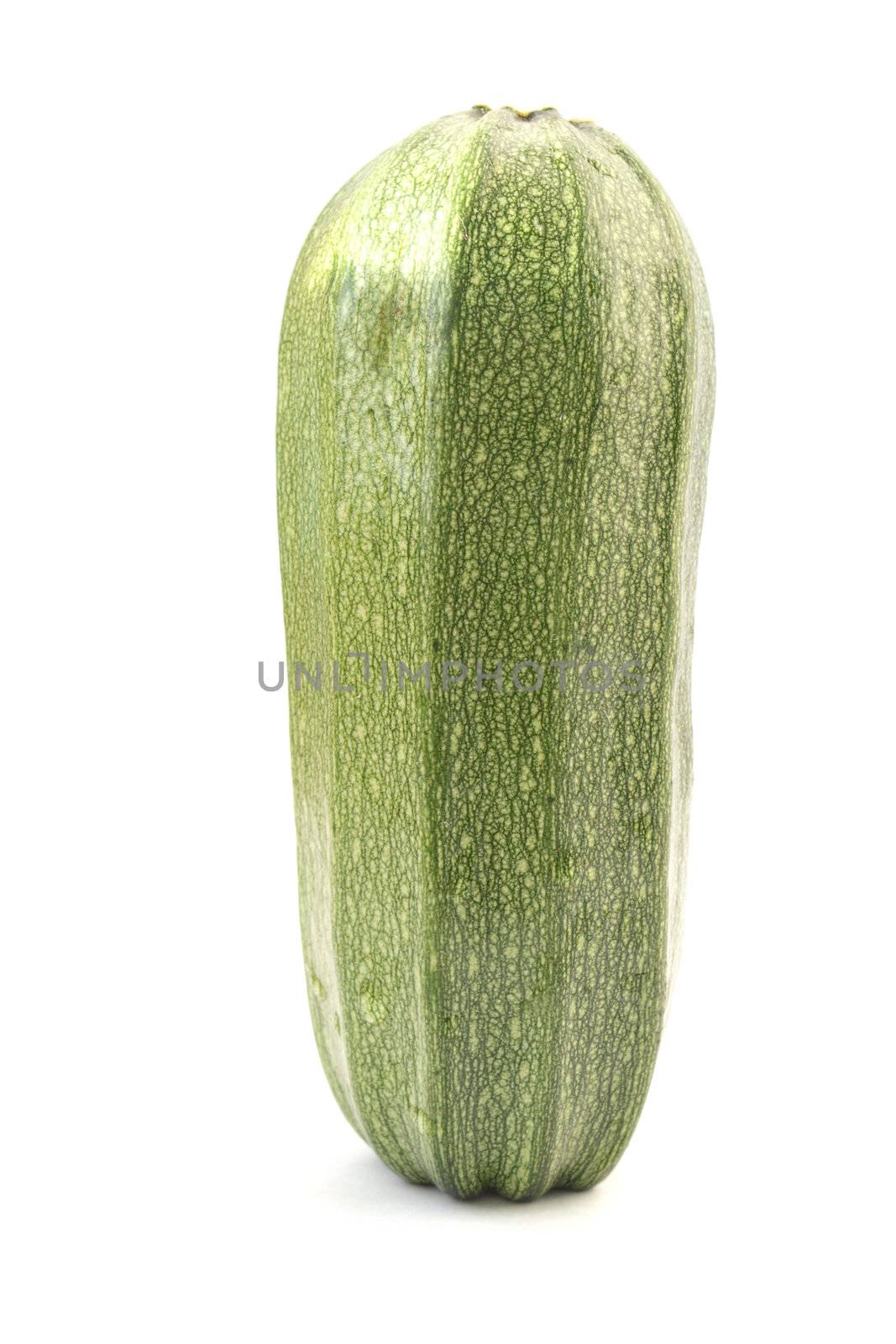 Single green zucchini isolated on white by pulen
