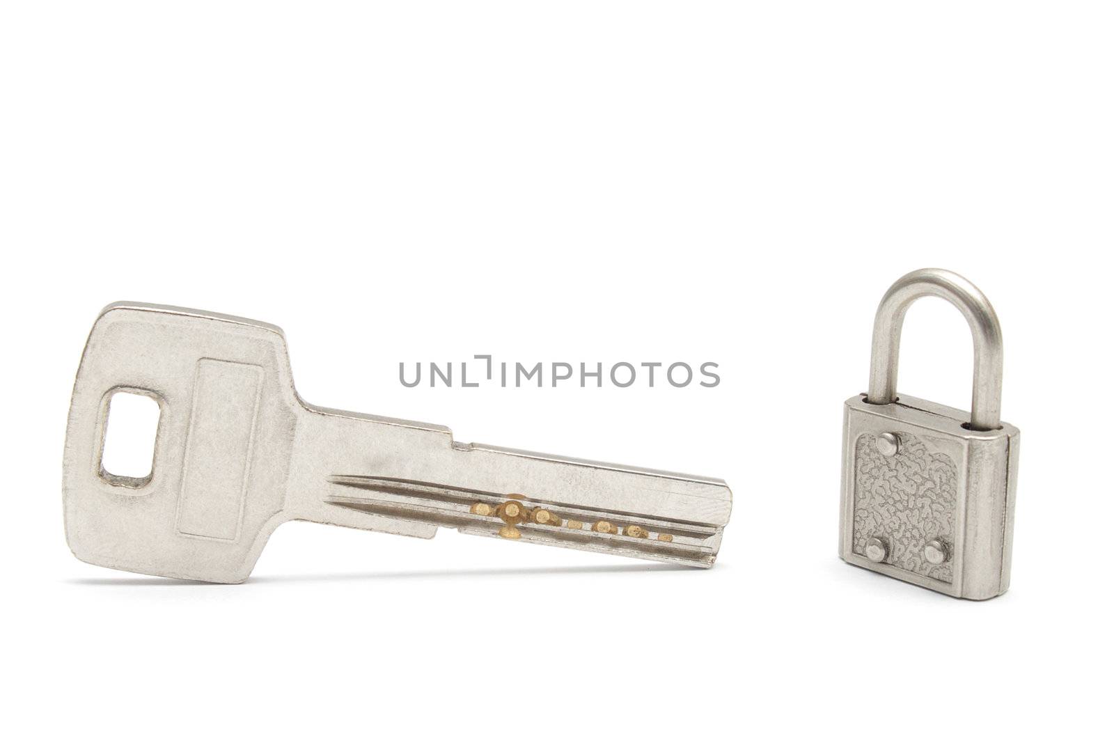 Big key and a small padlock isolated on white background
