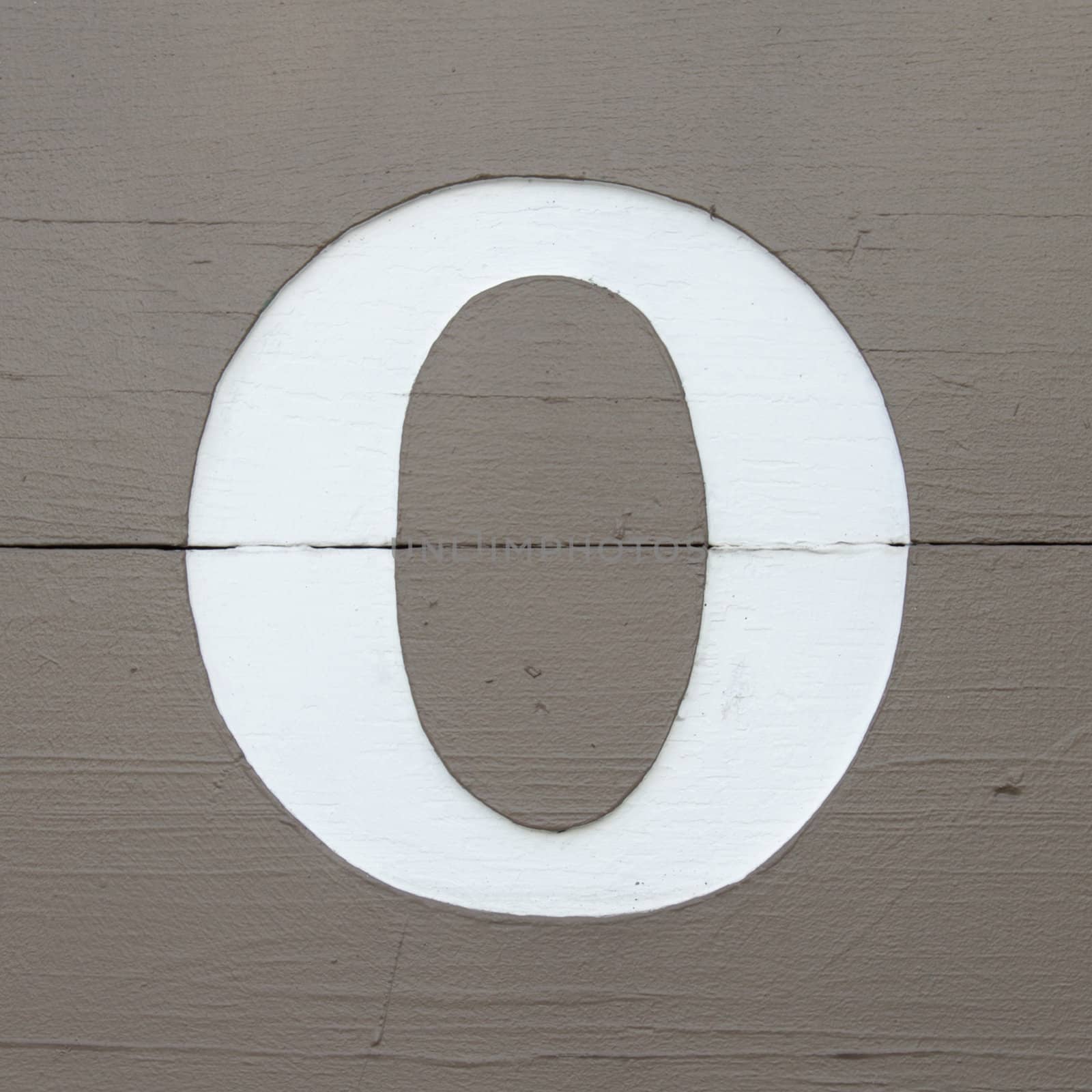 White letter O on wooden board by pulen