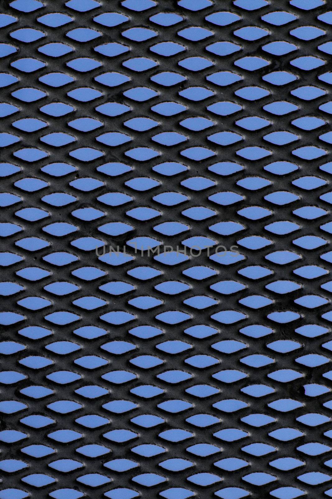 Metal grid over blue background by pulen