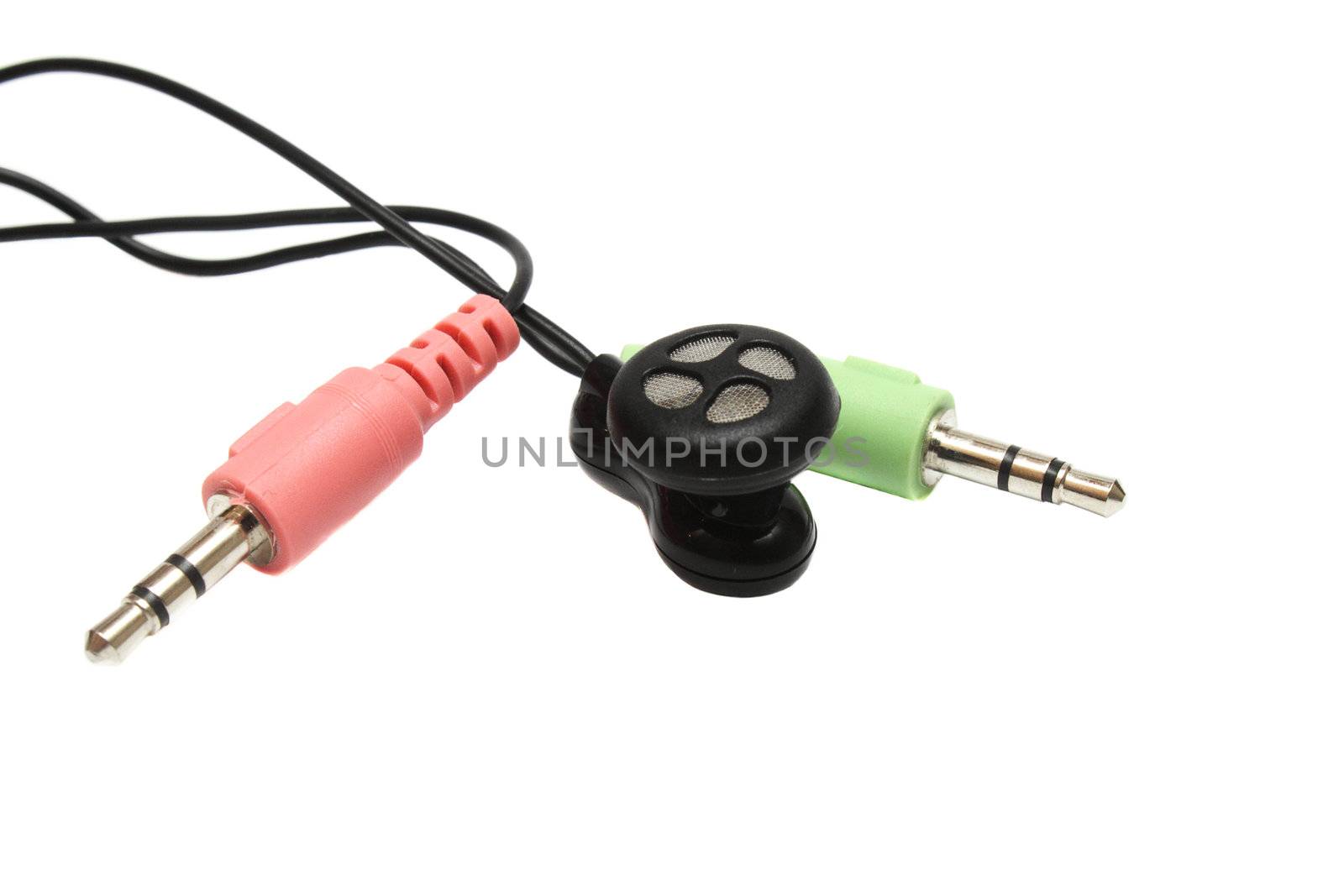 Microphone and headset plugs and a single earphone isolated on white background