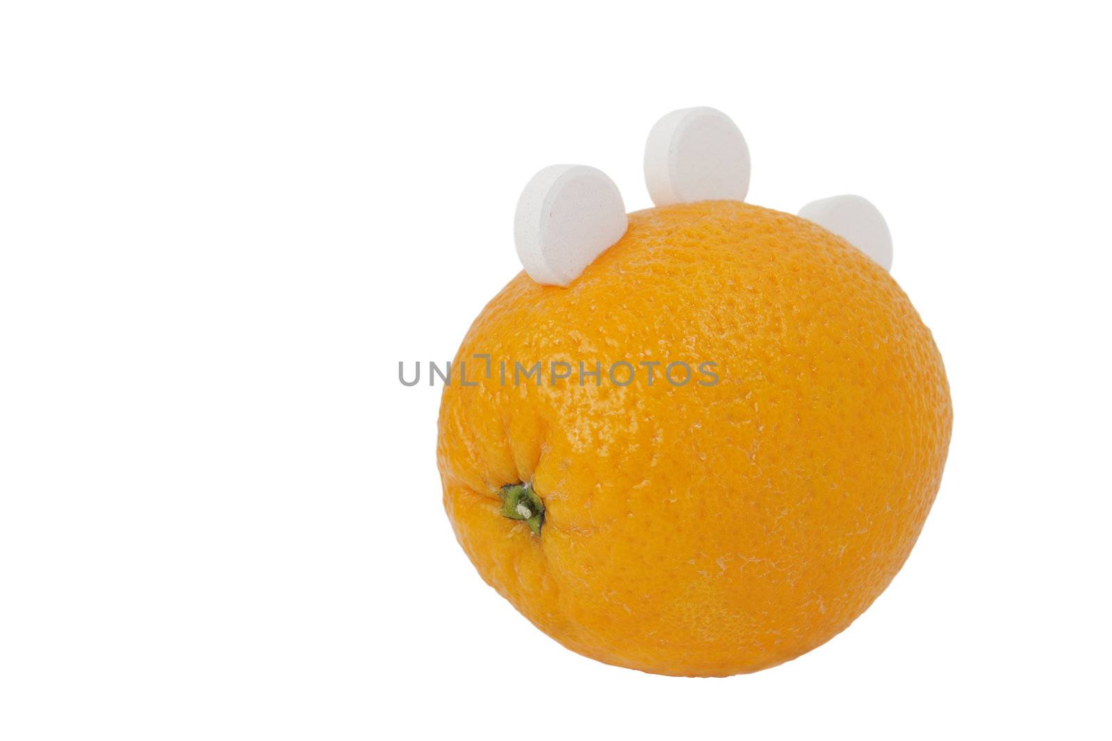 Ripe orange with three white round of vitamin C isolated on white background