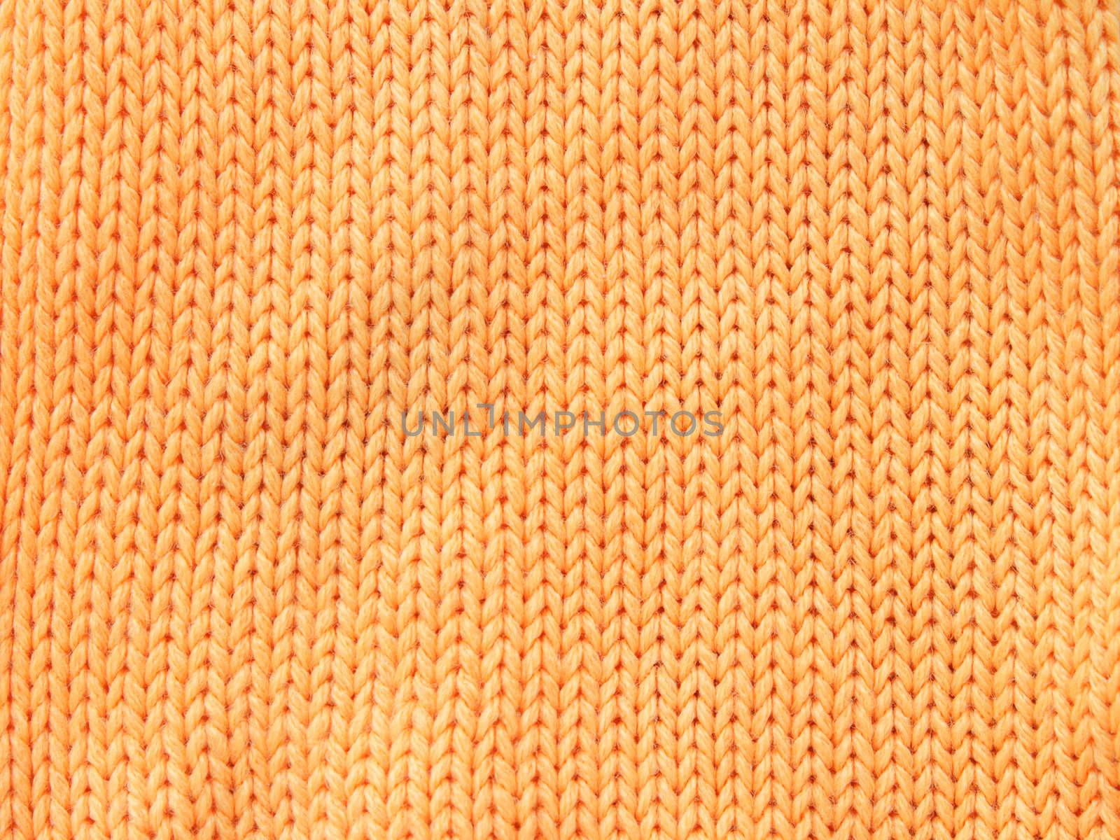 Closeup photo of the orange woolen clothe