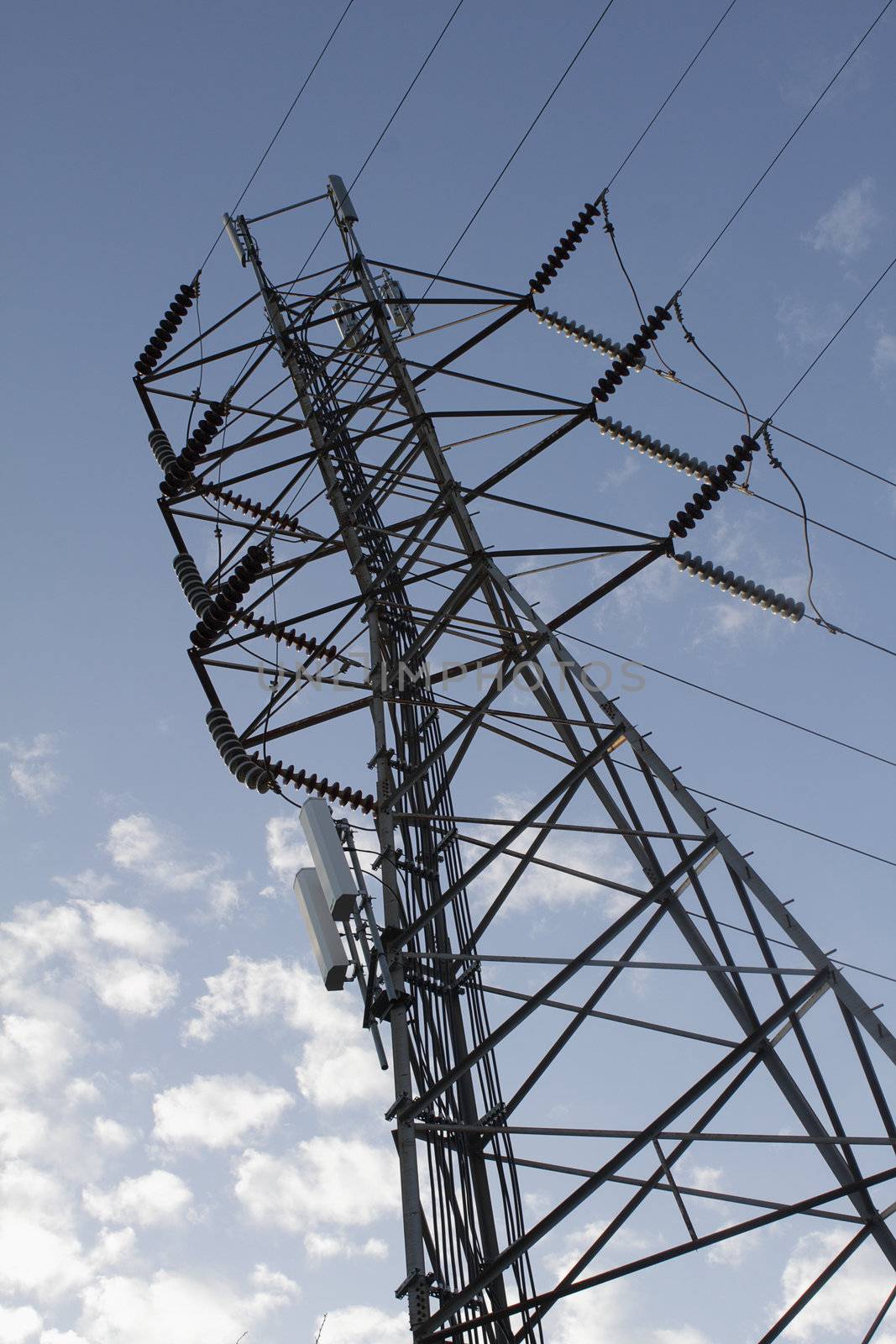 Tangent tower over blue sky, view from beneath