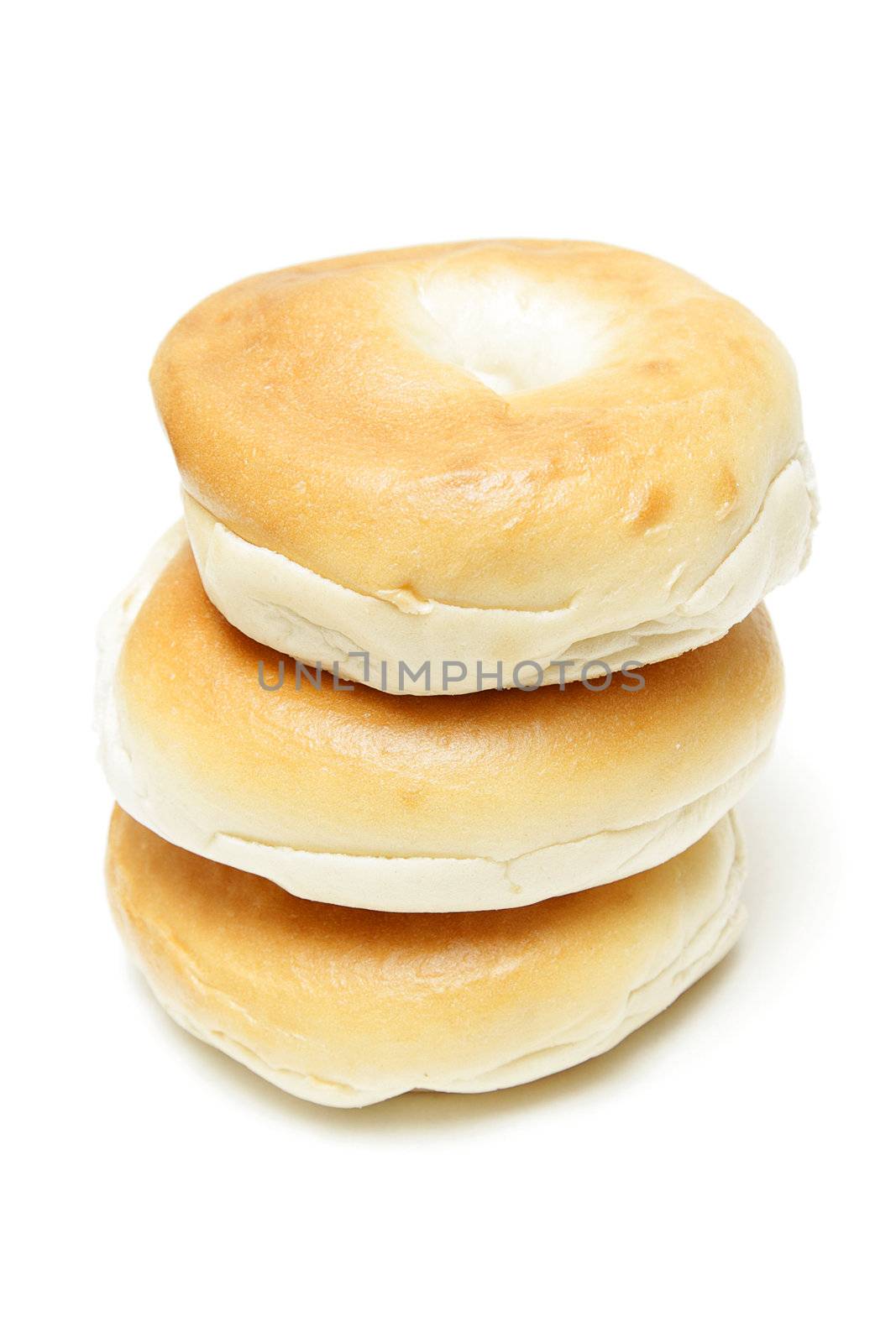 Stack of three bagels isolated on white background