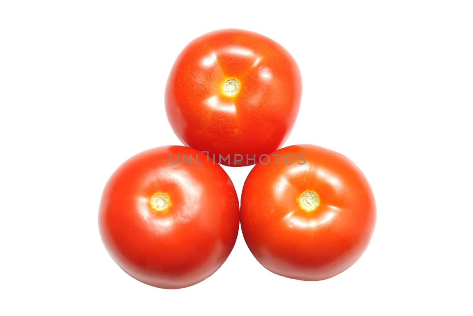 Three red ripe tomatoes isolated on white background