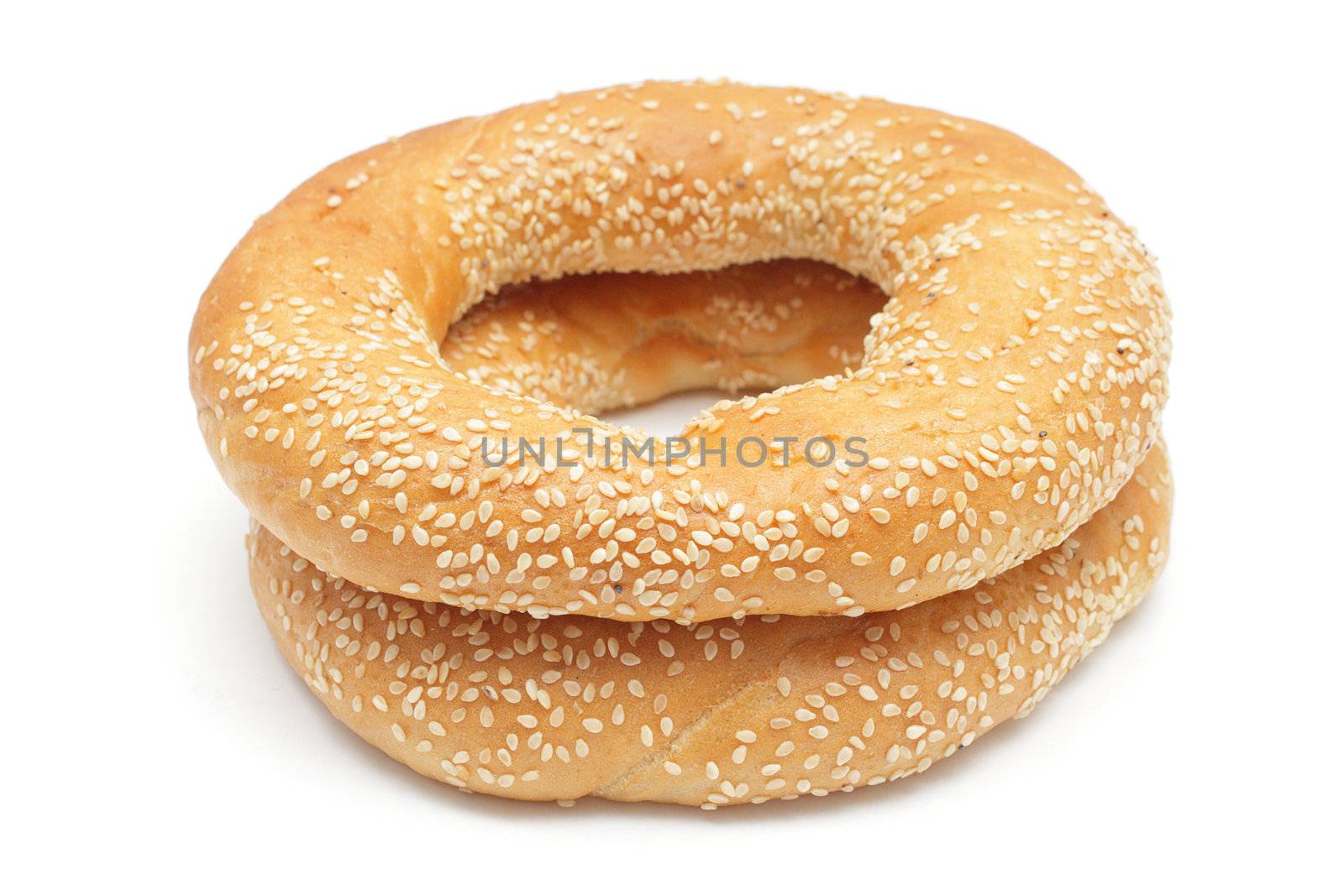 Two bagels with sesame seeds isolated on white background