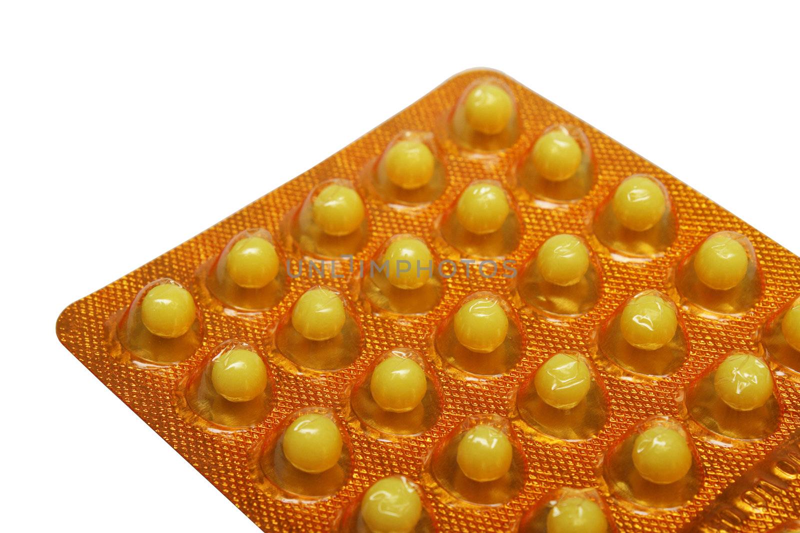 Vitamin C pills in the pack on white background