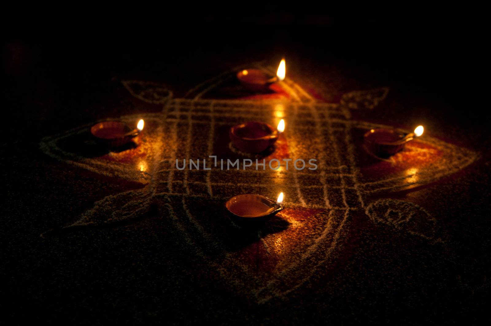 A mud lamp lit on the auspicious occasion of diwali