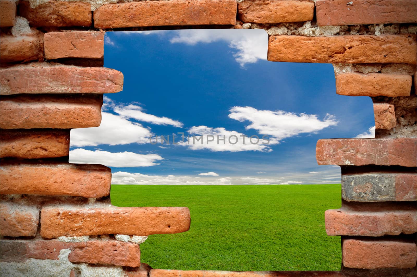 old brick wall in front of the blue sky