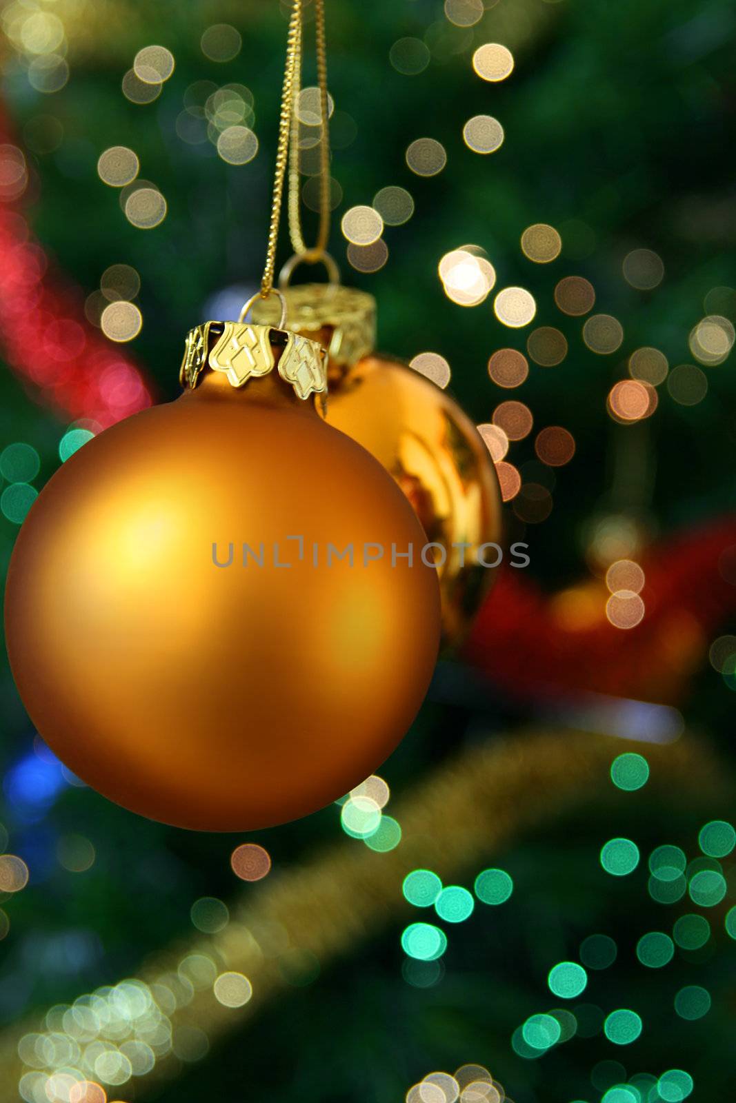 Christmas golden ball with a light blur creating bokeh in the background