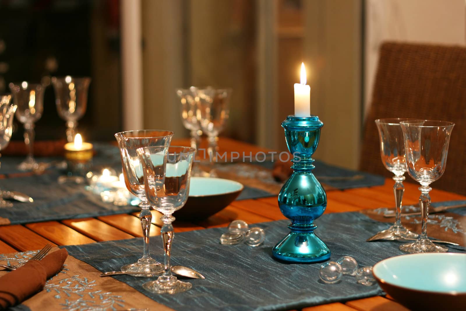 warm celebration table, focus on candlestick