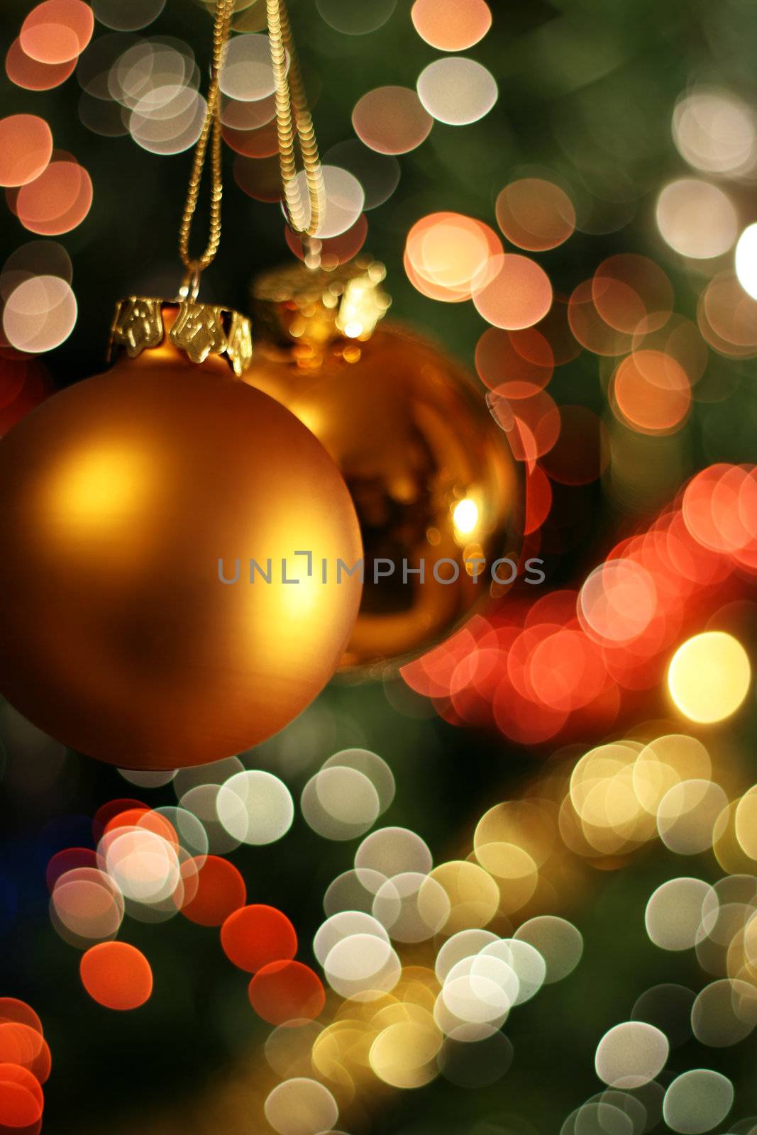 Christmas golden ball with a light blur creating bokeh in the background
