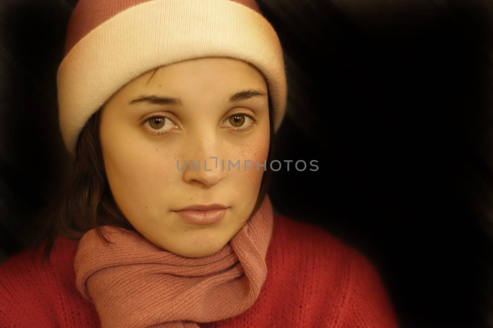 young beautiful girl portrait in a black background