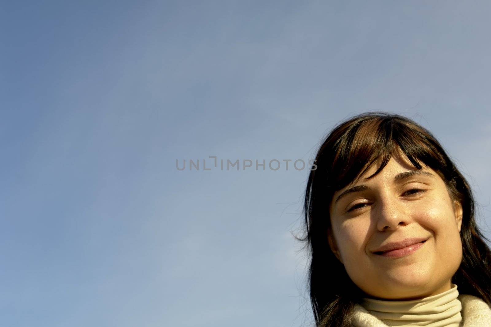 young woman close up portrait enjoying the sun