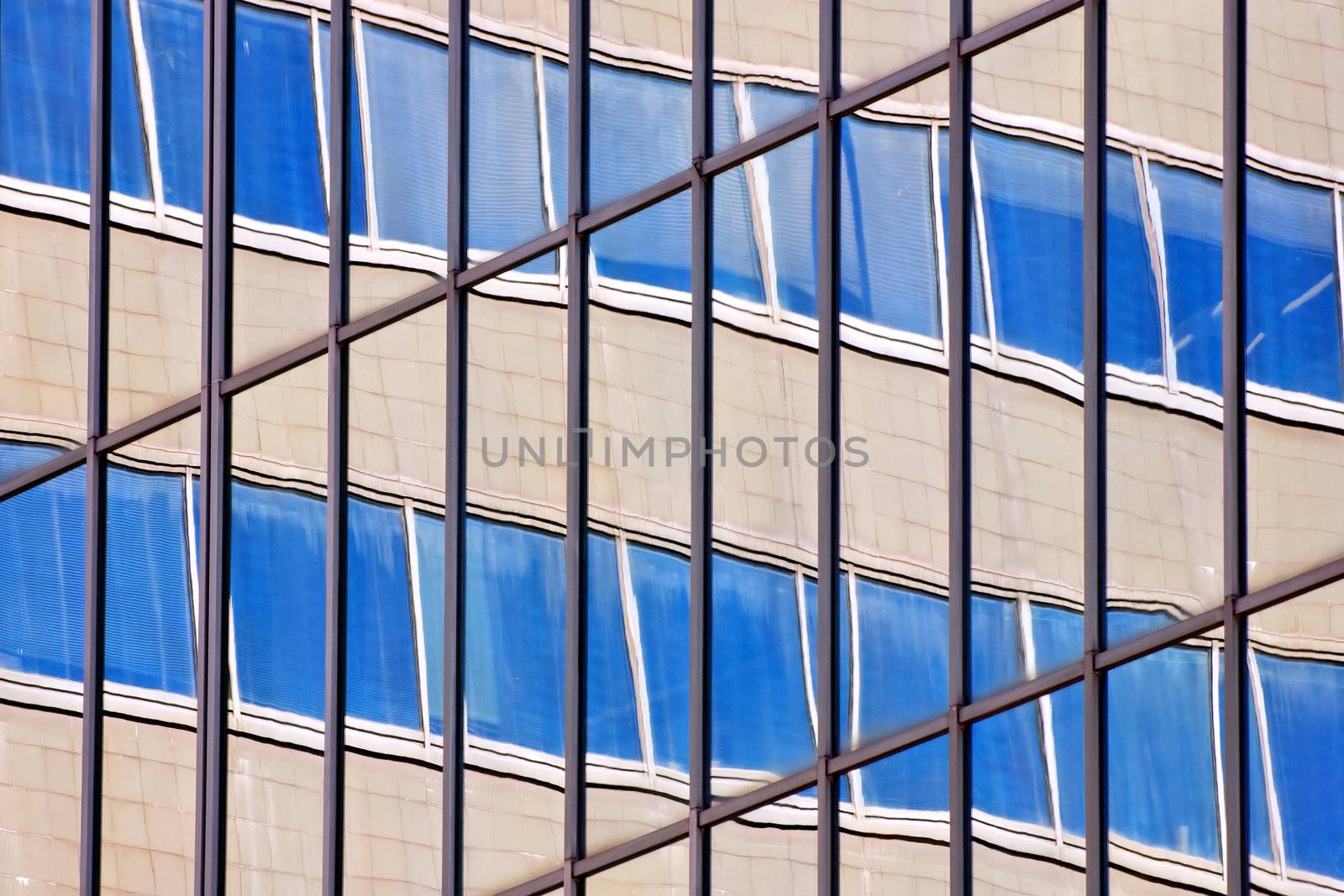 Building reflected in the glasses of another building