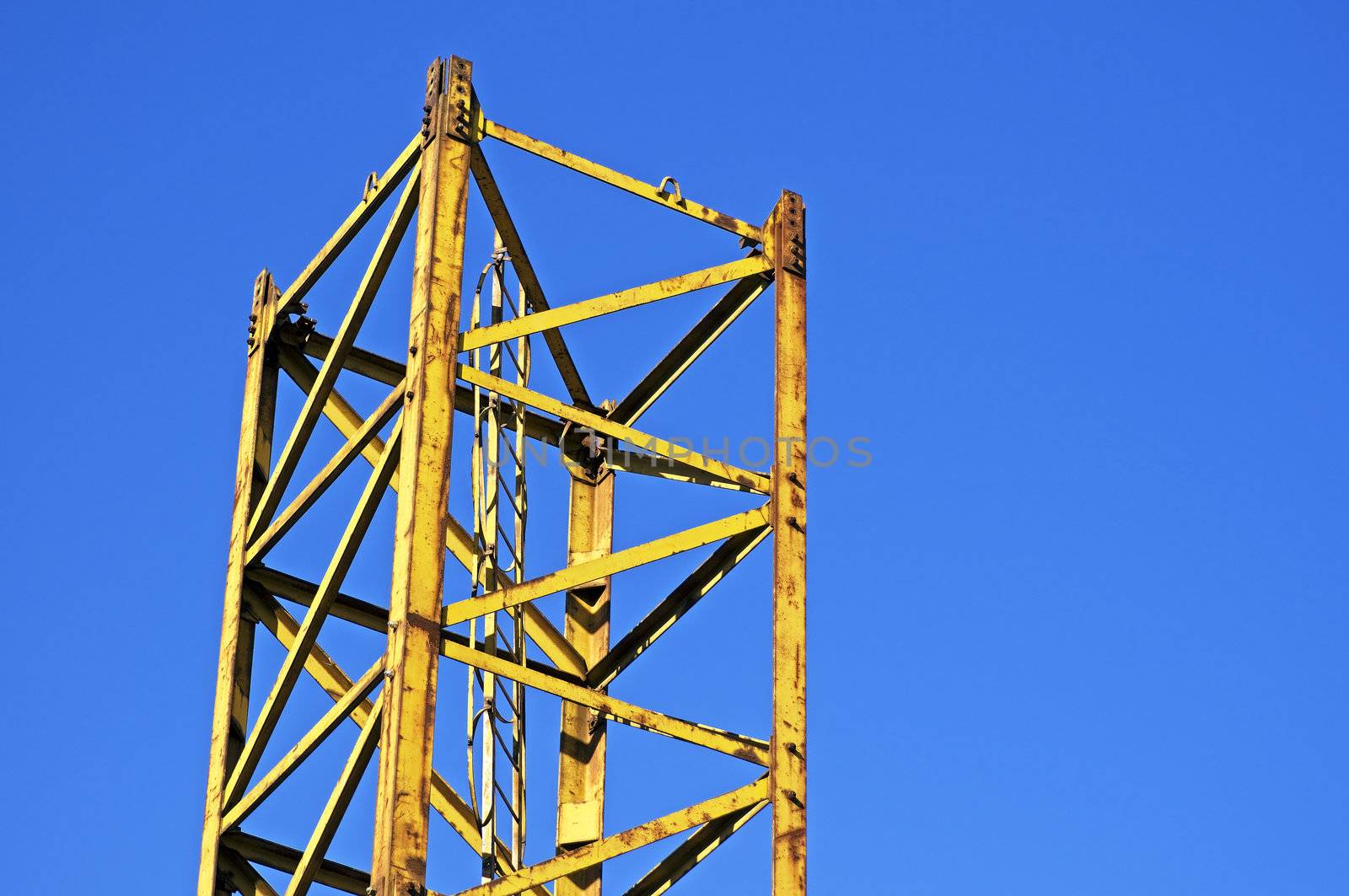 Yellow structure part against a blue sky