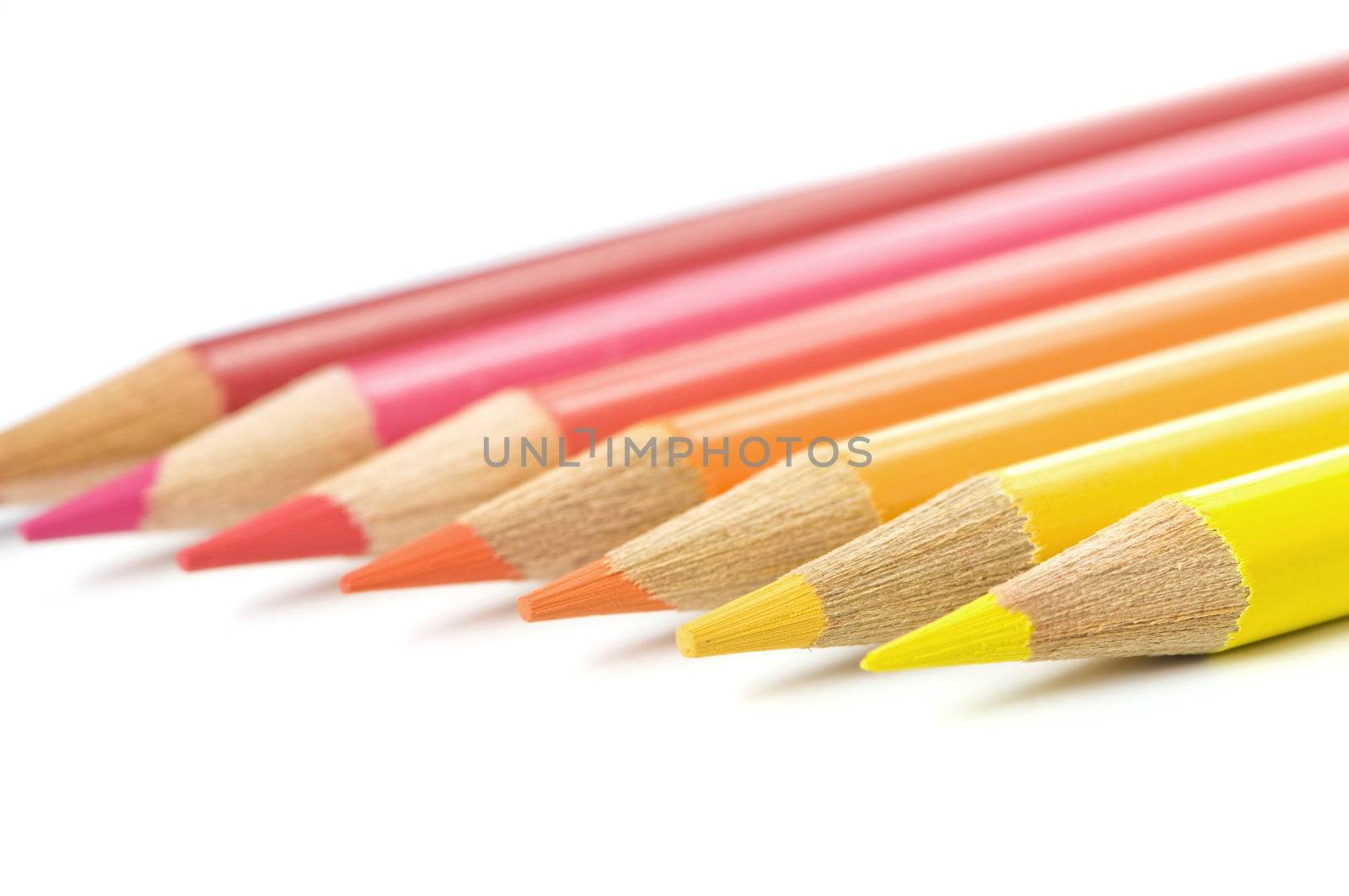 Coloured pencils from yellow to red, isolated on white