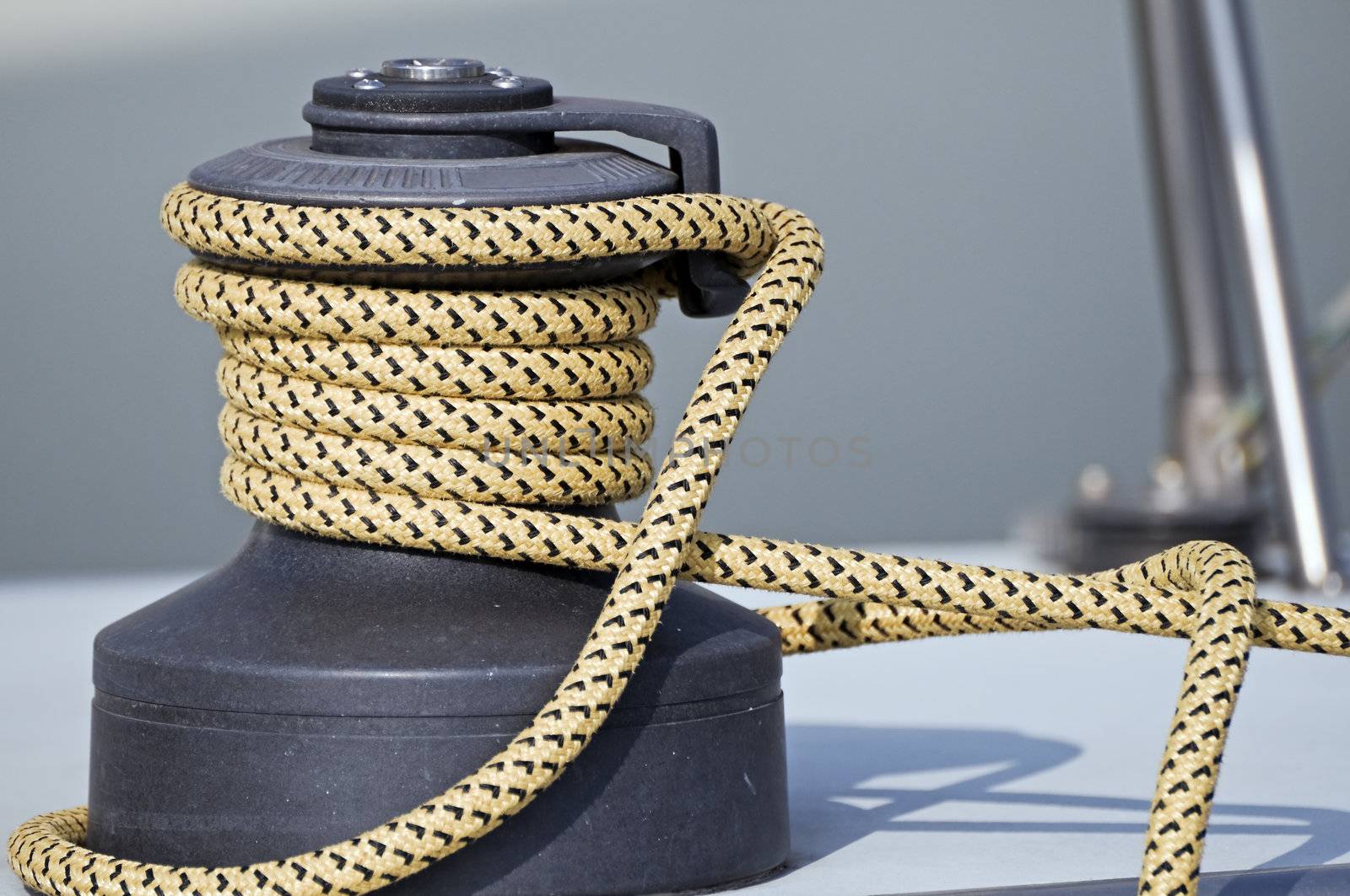 Rope rolled up on a winch in a sailboat