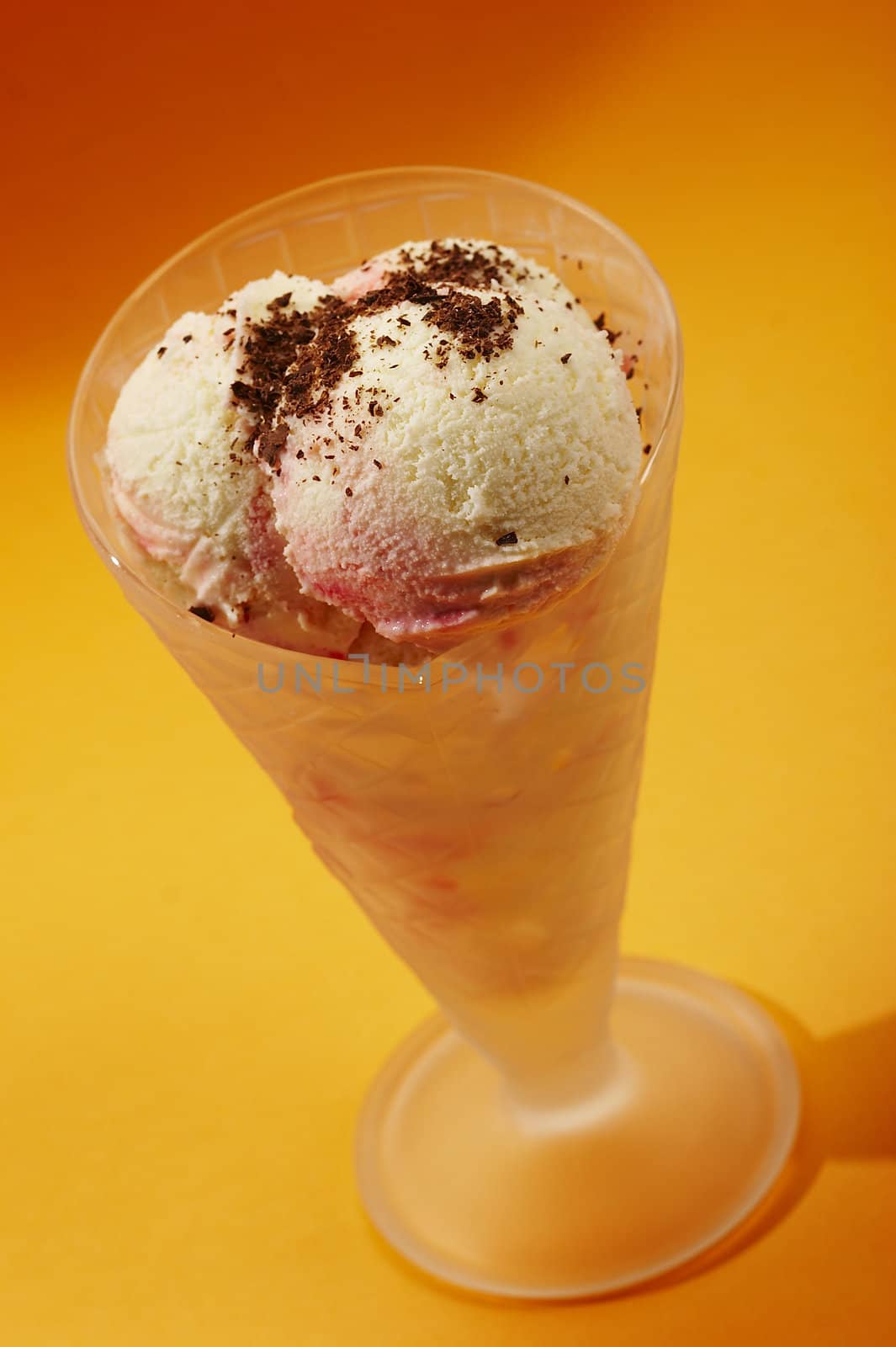 still life with ice-cream in the bowl over orange