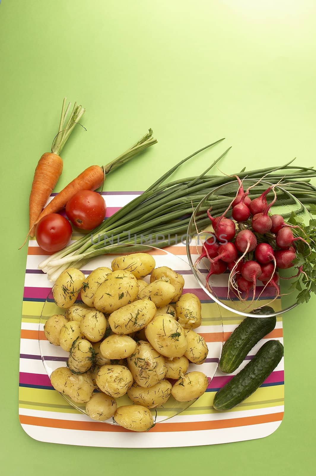 vegetarian still life: boiled new potatoes and fresh vegetables