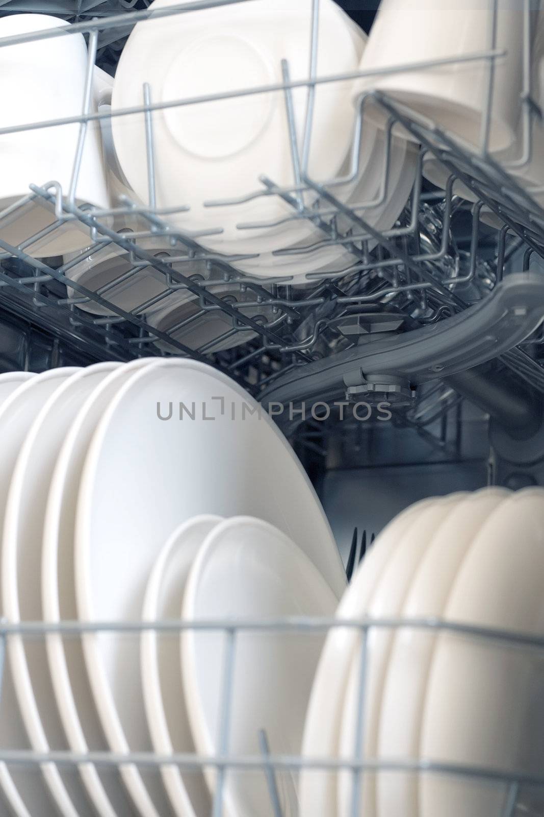 inside of dishwasher, focus inside, slightly blue toned