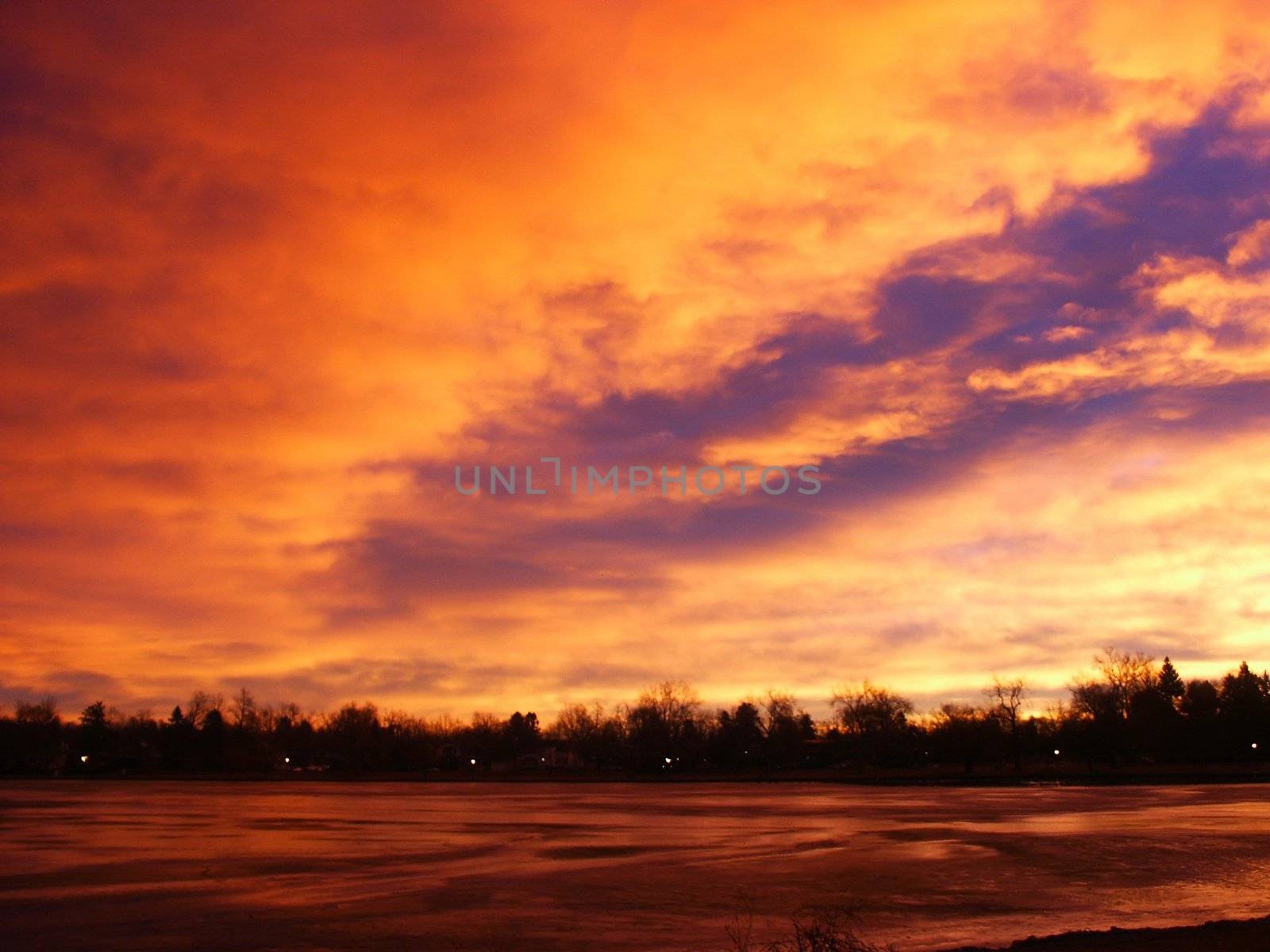 Fire Orange Sunrise on a Lake by jdebordphoto